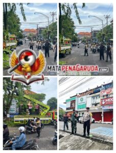 Bhabinkamtibmas bersama Babinsa dan Linmas Amankan Perompesan Pohon di Depan Kantor Desa Sumerta Kauh